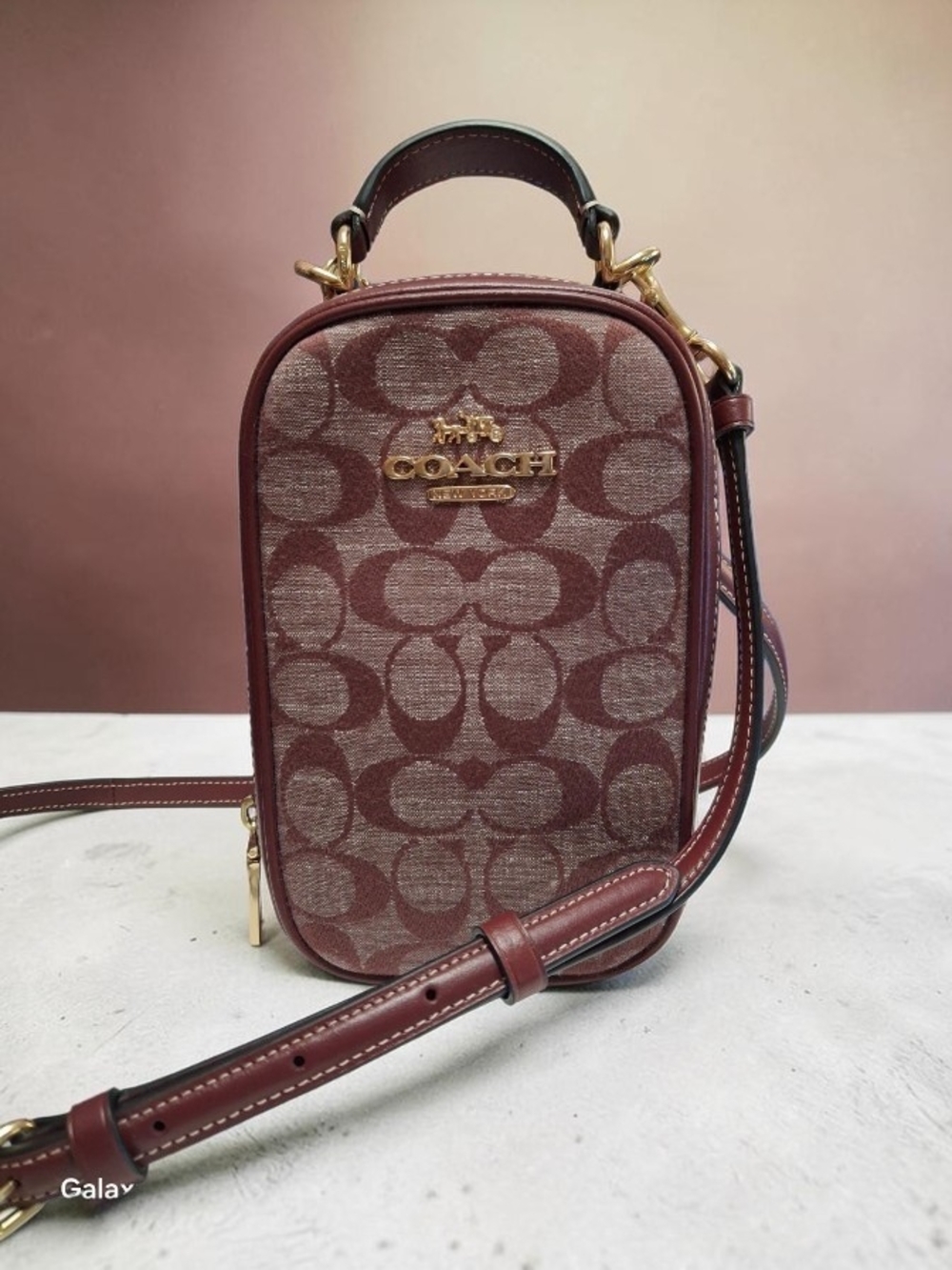 Coach Eva Phone Crossbody Bag in Burgundy and Tan Signature Canvas